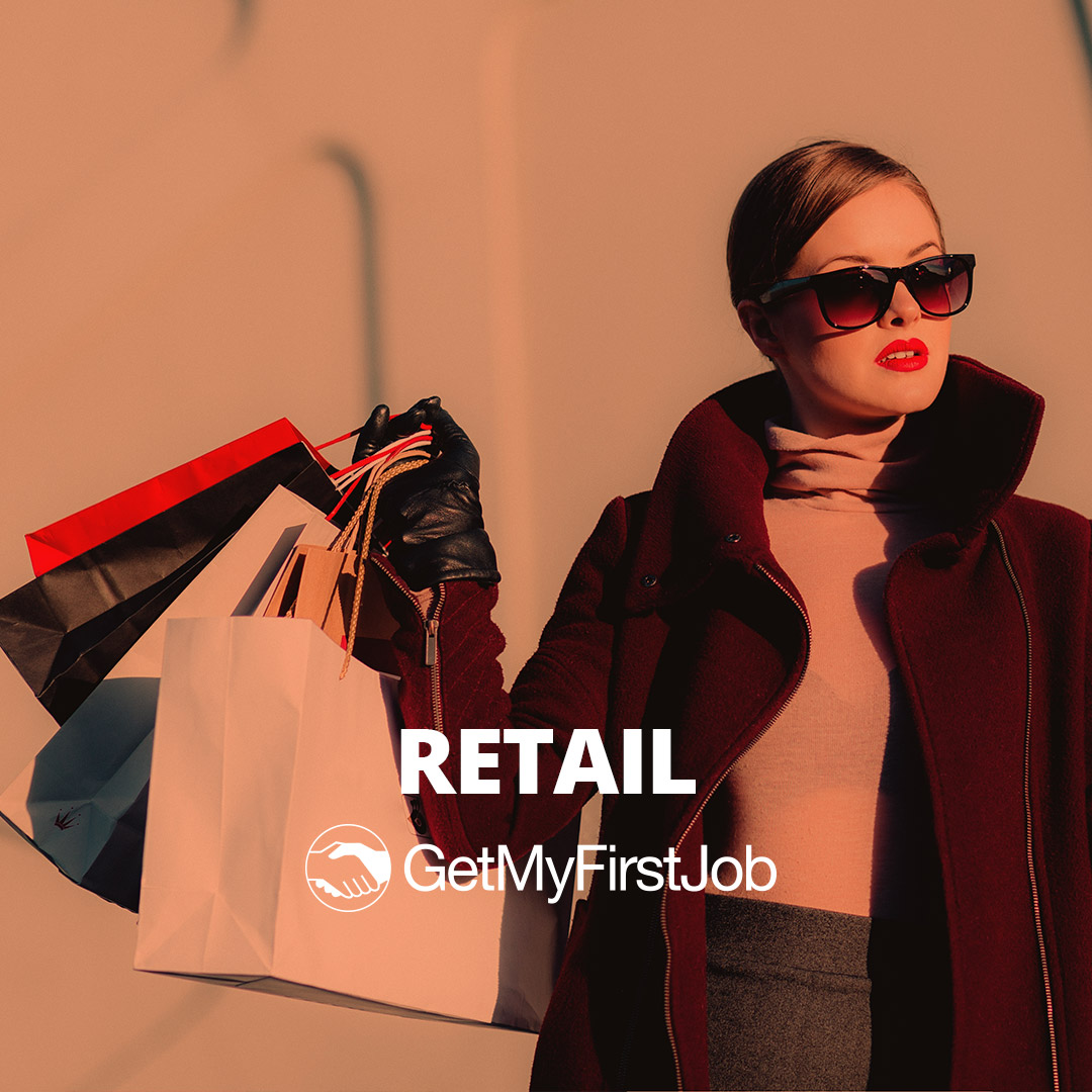 Fashionable young lady carrying lots of shopping bags
