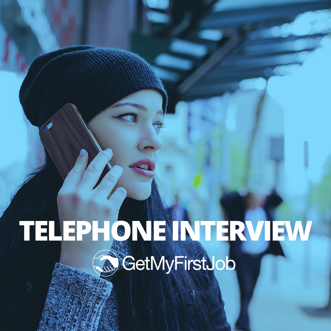 Girl on the phone with a hat on