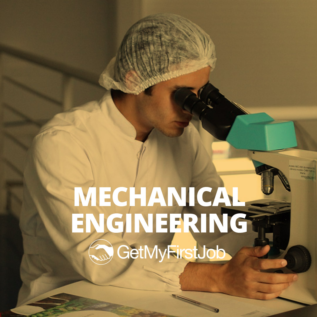 Man looking down a microscope
