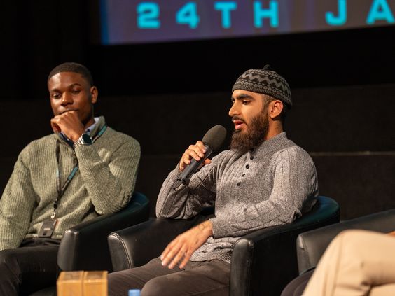 Umayr speaking on a panel event